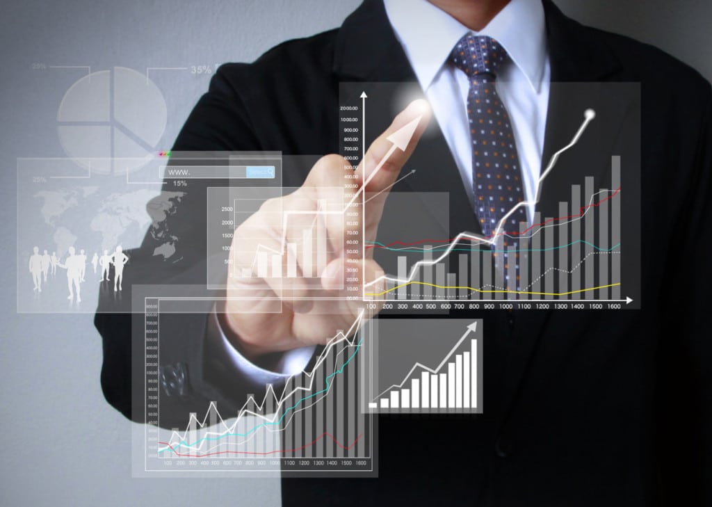 man scrolling graphs